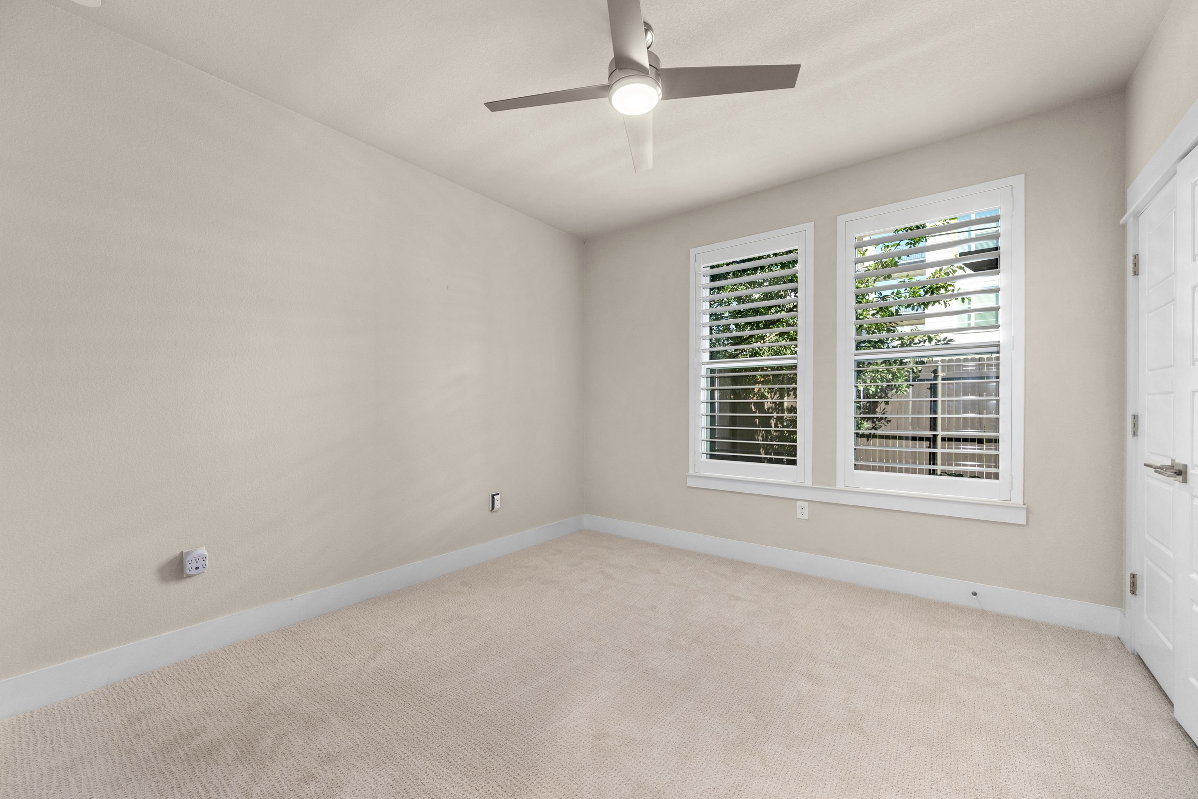 First-floor bedroom with courtyard access