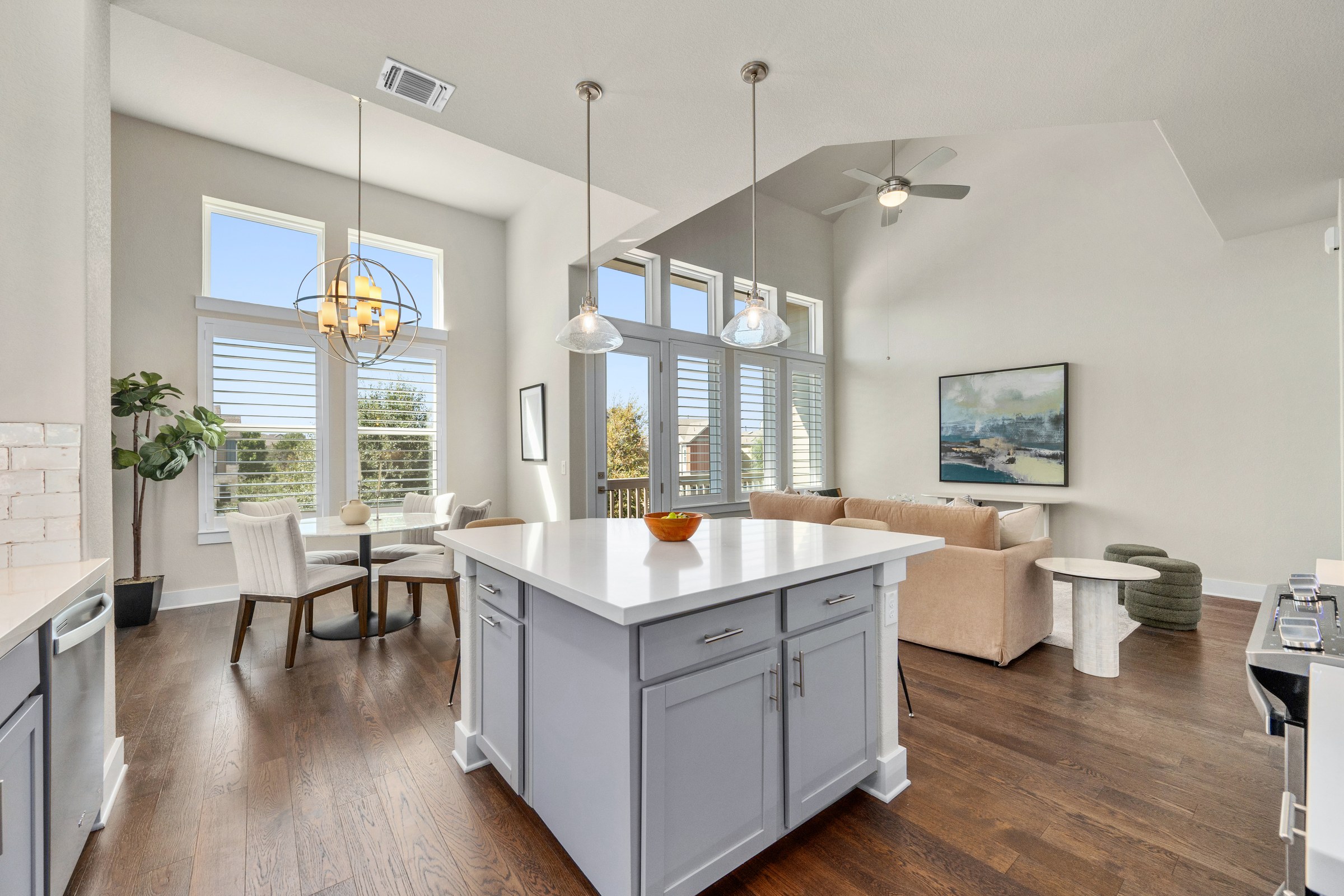 Open kitchen, dining, and living areas